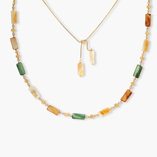 Adjustable necklace featuring an elegant arrangement of green, amber, and cream shell beads with gold accents.
