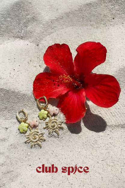 Oval hoop earrings with sun and bead charms