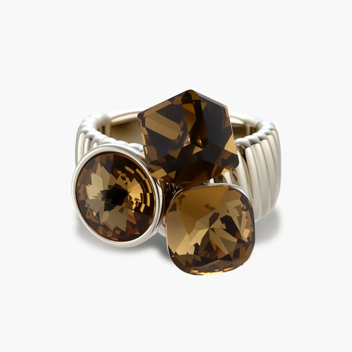 Silver-plated adjustable cocktail ring featuring three golden-brown zirconia stones in mixed cuts on textured band