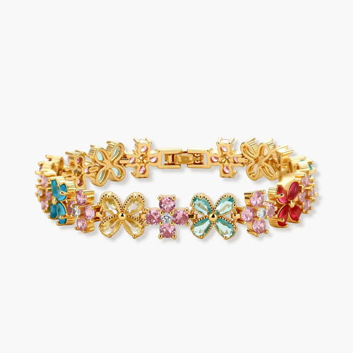 Gold-plated jewelry set with pink, turquoise and red flower-shaped cubic zirconia stones, featuring necklace, earrings and bracelet.