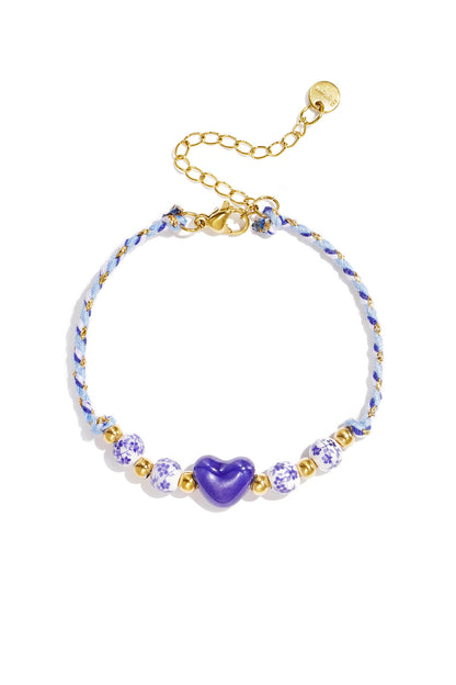 Braided bracelet with design and heart beads