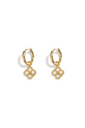 Small hoop earrings with zirconia-set clover charm