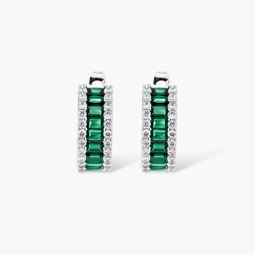 White gold plated jewelry set with emerald green rectangular stones and clear crystals in geometric rows on white background.