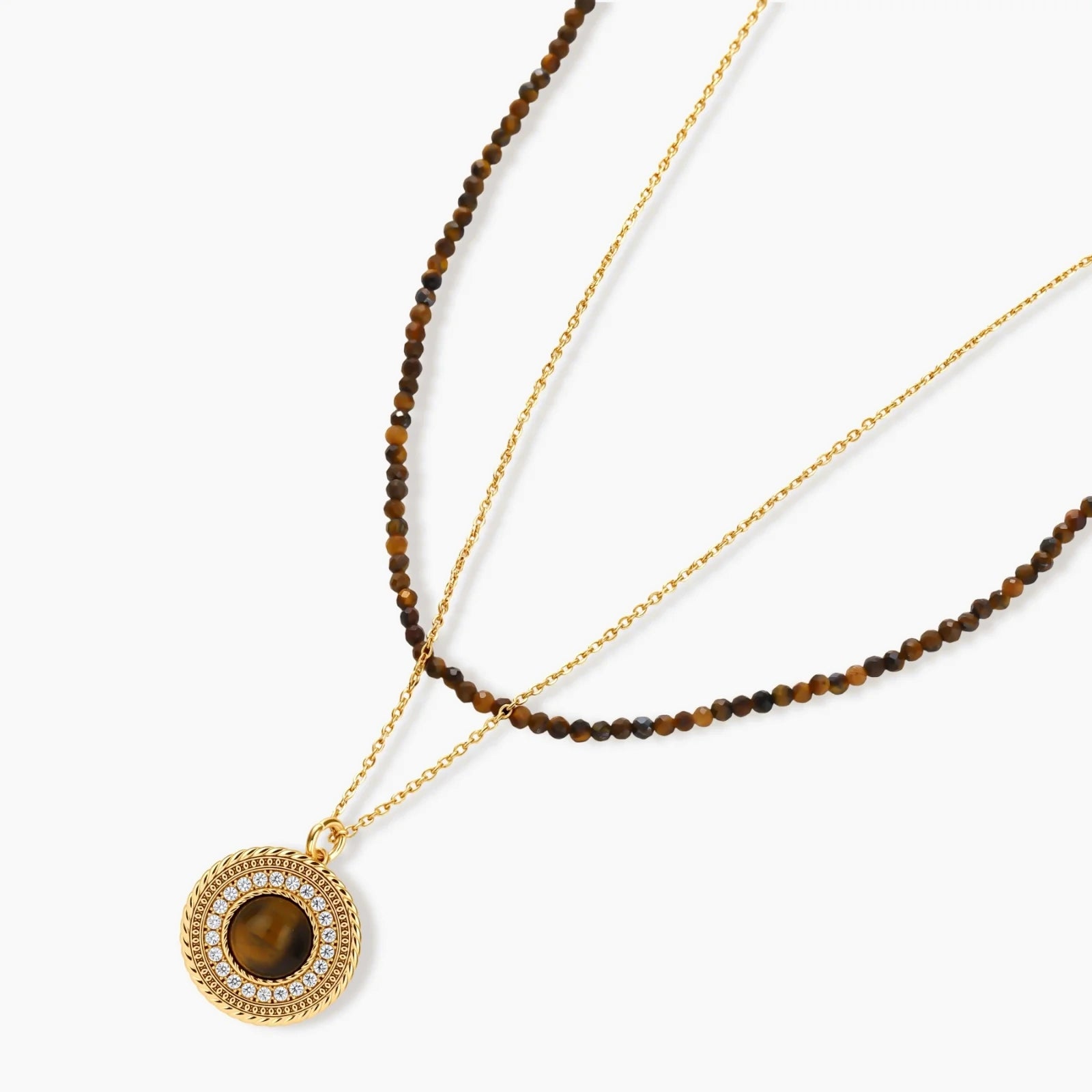 Gold-plated circular pendant necklace and matching earrings with natural stone centers and ornate rope detailing