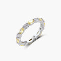 Platinum-plated copper ring with alternating clear and pale yellow oval stones in an eternity band design on white background.