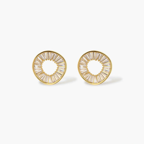 Gold-plated necklace and earring set with circular CZ crystal pendants featuring radial design on cream background