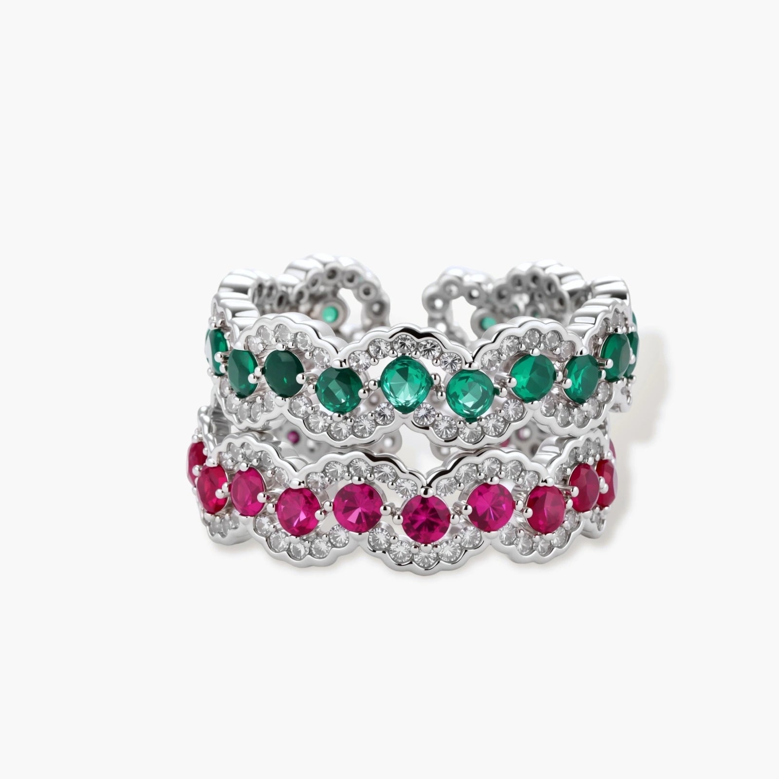 Platinum-plated copper ring with green zirconia stones in decorative scalloped wave pattern, adjustable band design.