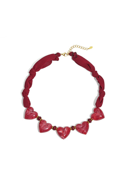 Fabric necklace with heart beads