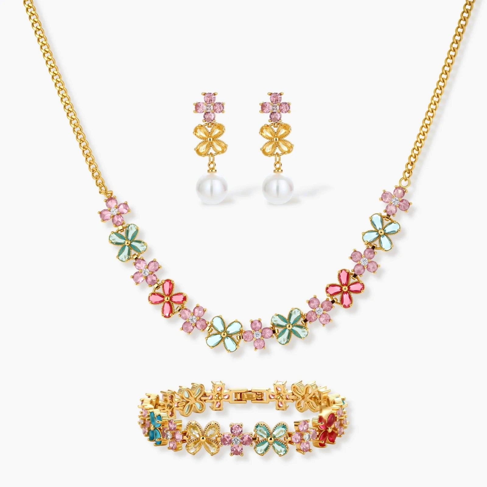 Gold-plated jewellery set featuring a floral necklace and bracelet in pink, mint, aqua, and red, complemented by pearl earrings.
