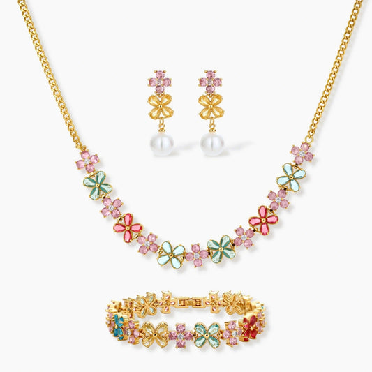 Gold-plated jewellery set featuring a floral necklace and bracelet in pink, mint, aqua, and red, complemented by pearl earrings.
