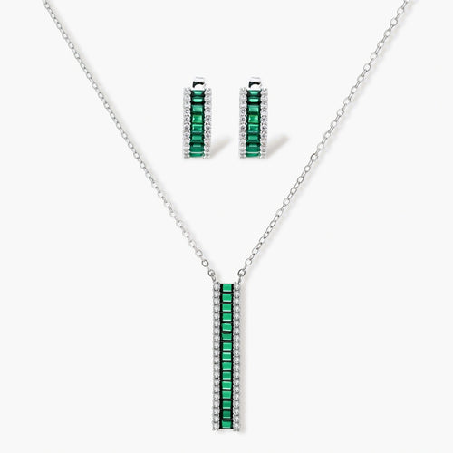 Elegant jewellery set featuring a necklace with green baguette elements and matching huggie earrings in a refined silver tone.