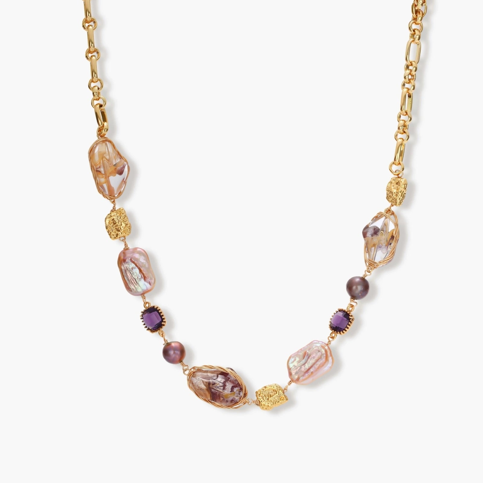 Gold-plated necklace with baroque pearls, purple amethyst stones, and wire-wrapped details on white background.