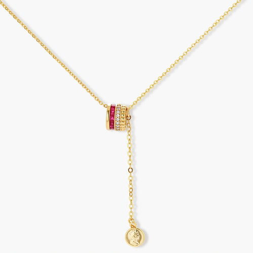 Three-piece jewelry set featuring 14K gold plated pieces with deep red cubic zirconia stones and clear crystals on cream background.