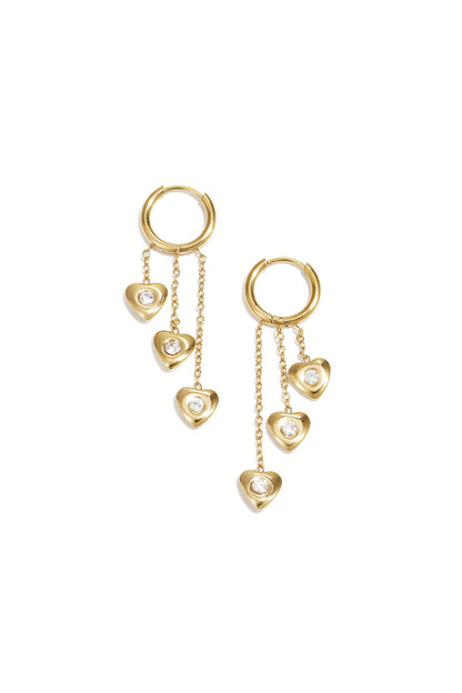 Earrings with dangling hearts at different heights