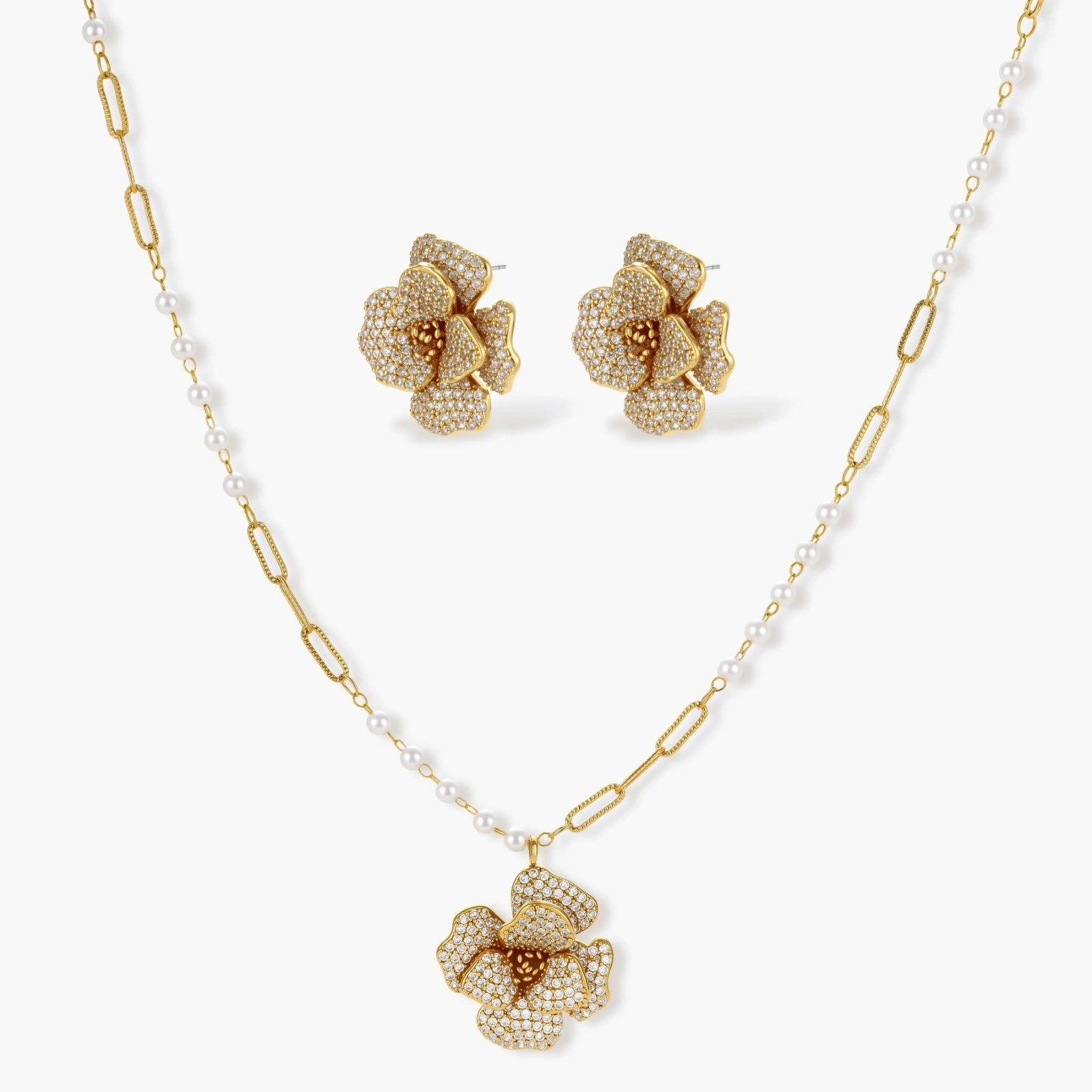 Floral necklace and matching earrings in a gold tone, showcasing exquisite craftsmanship and elegance.