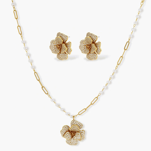 Floral necklace and matching earrings in a gold tone, showcasing exquisite craftsmanship and elegance.