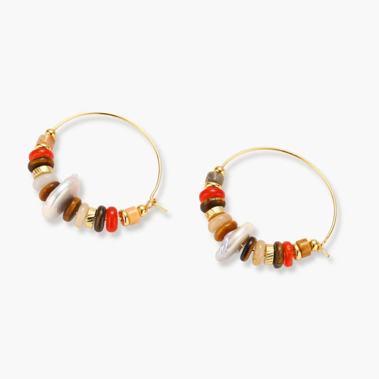 Slim gold hoops adorned with a stack of red, amber, and brown stone beads, featuring an elegant flat baroque pearl.