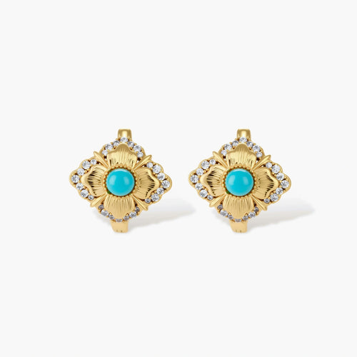 Close-up of 18K gold plated hoop earrings with turquoise center stones and zircon crystals in quatrefoil flower design
